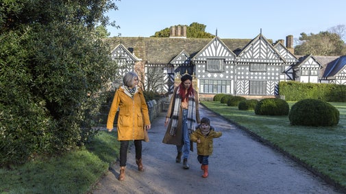Family exploring the wintry garden